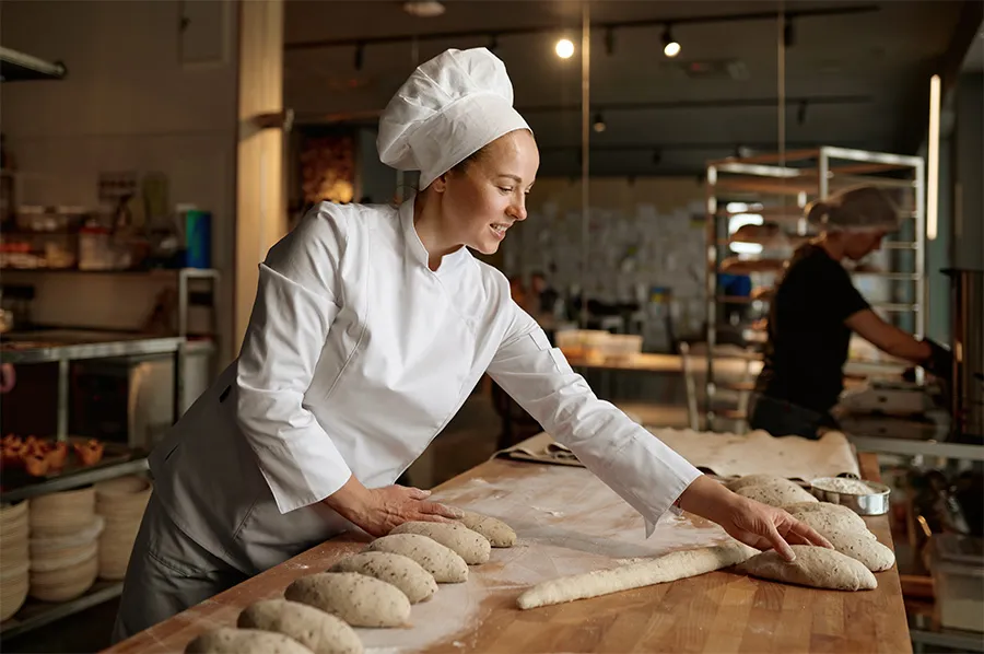 Bild zum Wort „baker“: A person whose job is to make and sell bread and cakes.